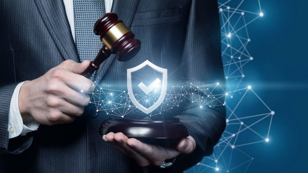 A shield with a lock symbolizing protection against cyber attacks.