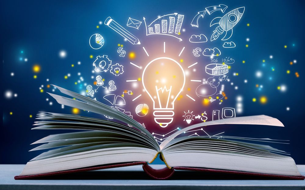 Open book with light bulb and business icons on blue background. A symbol of knowledge, creativity, and entrepreneurship.