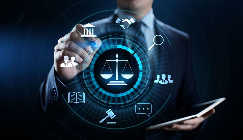 A businessman confidently holds a tablet displaying a justice icon, symbolizing the intersection of technology and the legal system.