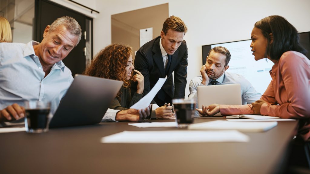 a group of people in a meeting