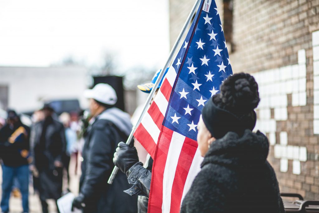 a woman holding a flag