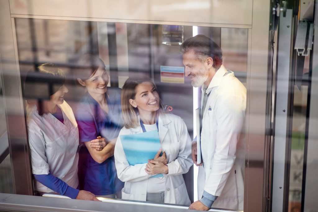 a group of people in white coats