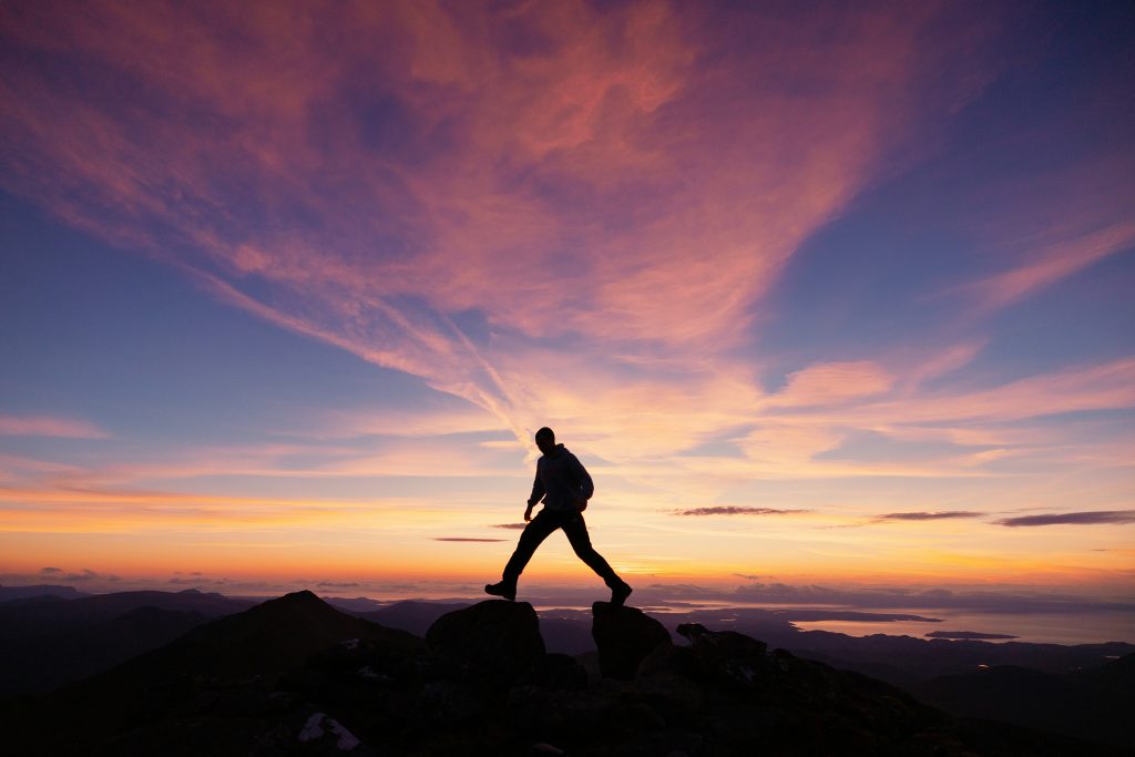 a person walking on a rock